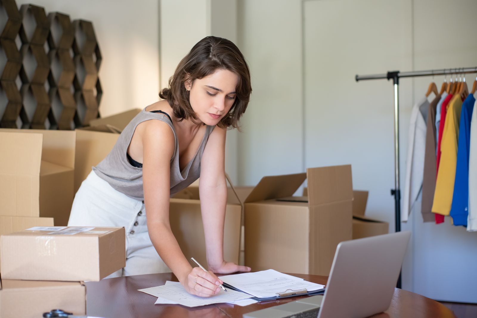 Small business owner managing online sales and shipping from a home office